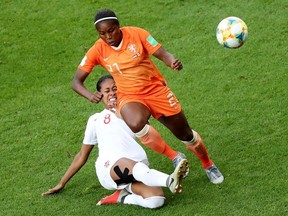 Netherlands' Lineth Beerensteyn in action with Canada's Jayde Riviere .