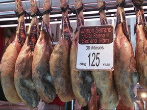 The Boqueria Market displaying the famous Serrano ham in Barcelona, Spain. Veronica Henri/Toronto Sun/Postmedia Network
