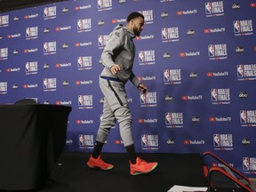 Golden State Warriors’ Steph Curry leaves the podium after speaking with reporters following practice on Saturday at Scotiabank Arena. Game 2 goes Sunday night. (JACK BOLAND/TORONTO SUN)