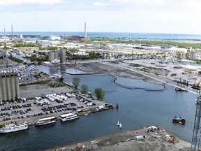 This YouTube screenshot shows the area at the east end of Toronto Harbour that's the subject of lengthy discussions between the city, Waterfront Toronto and Sidewalk Labs. In the foreground is the Parliament St. Slip on the east and north sides of which is Quayside, a proposed "green" development that would include new business, residential buildings and public space. The existing Keating Channel runs from the mouth of Don River westerly to Toronto harbour. On the north side of the Channel are areas known as Keating East and Keating West. Taking shape in the Channel we can see the creation of a new man-made island, part of the massive Don Mouth Naturalization and Flood Protection project. This new island incorporates Villiers East and Villiers West Precincts. South of the new island is the Polson Quay. In the distance and south and east of the mouth of the Don River is the McCleary District. In the centre far distance is the $9 million, 215 meter tall stack at the former Hearn Generating Station. The plant stopped generating power in 1983.