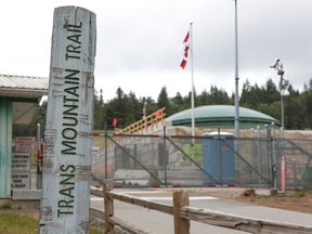 A marker for the Trans Mountain Trail is pictured outside the Kinder Morgan Burnaby Terminal and Tank Farm in Burnaby, B.C., on June 20, 2019.
