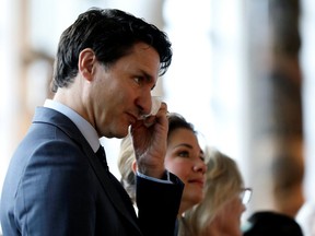 Canada's Prime Minister Justin Trudeau wipes his eyes during the closing ceremony of the National Inquiry into Missing and Murdered Indigenous Women and Girls in Gatineau, Quebec, Canada, on June 3, 2019. (REUTERS/Chris Wattie)