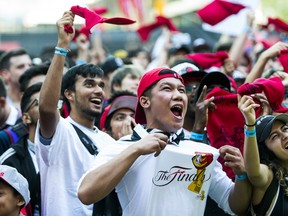 Toronto Raptors fans get hyped before the NBA Finals Game 4 against the Golden State Warriors held outside of the Scotiabank Arena at Jurassic Park in Toronto, Ont. on Friday June 7, 2019. Ernest Doroszuk/Toronto Sun/Postmedia