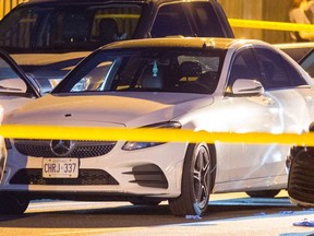 A white Mercedes is surrounded by unmarked police cars in the wake of a deadly officer-involved shooting Tuesday, June 25, 2019 on Midland Ave. north of Lawrence Ave.