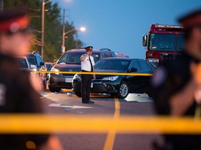 Deputy Chief Peter Yuen surveys the scene of an officer-involved shooting on Midland Ave. north of Lawrence Ave. on Tuesday, June 25