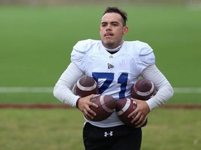 Kicker Gabriel Amavizca Oritiz collects footballs during Winnipeg Blue Bombers rookie camp on the University of Manitoba campus on Wed., May 15, 2019.