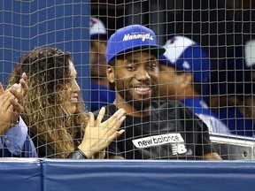 Kawhi Leonard of the Toronto Raptors watches a MLB game between the Los Angeles Angels of Anaheim and the Toronto Blue Jays at Rogers Centre on June 20, 2019 in Toronto, Canada.  (Photo by Vaughn Ridley/Getty Images)