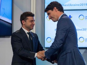 Canadian Prime Minister Justin Trudeau greets Ukrainian President Volodymyr Zelensky at the Ukrainian Reform conference in Toronto on July 2, 2019.