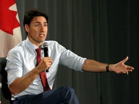 Prime Minister Justin Trudeau answers questions during a conversation with moderator Nikki Macdonald at a Liberal Party fundraising event at the Delta Ocean Pointe Resort in Victoria, B.C., on Thursday, July 18, 2019. THE CANADIAN PRESS/Chad Hipolito
