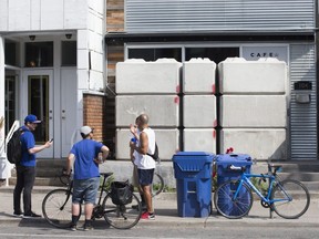 Concrete barriers bar entry to an illegal pot dispensary at 104 Harbord St. on Friday, July 19, 2019.