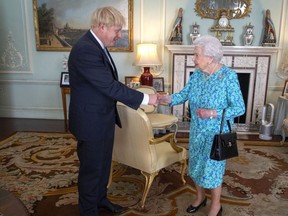 Queen Elizabeth welcomes newly elected leader of the Conservative party, Boris Johnson during an audience where she invited him to become Prime Minister and form a new government in Buckingham Palace on July 24, 2019 in London,. ( Victoria Jones - WPA Pool/Getty Images)