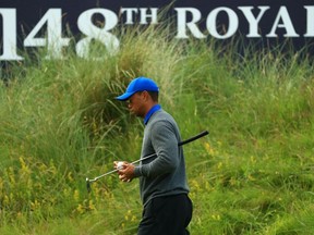 Tiger Woods of the United States reacts on the 18th hole during the first round of the 148th Open Championship held on the Dunluce Links at Royal Portrush Golf Club on July 18, 2019 in Portrush, United Kingdom.