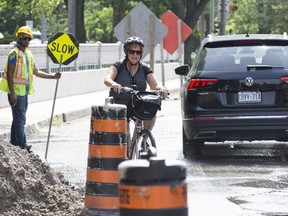 Columnist Sue-Ann Levy navigates through Rosedale on Sue-Ann Levy navigates her bike through Rosedale on July 19, 2019. (Craig Robertson, Toronto Sun)