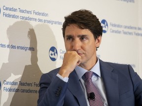 Prime Minister Justin Trudeau listens to a question during a discussion at the Canadian Teachers Federation annual general meeting in Ottawa, Thursday, July 11, 2019. (THE CANADIAN PRESS/Adrian Wyld)
