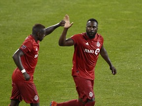 Toronto FC forward Jozy Altidore (right) celebrates a goal Chris Mavinga during Saturday's win against the Montreal Impact. (USA TODAY SPORTS)