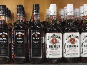 Jim Beam bottles line the counter at the Jim Beam visitors' center at Clermont, Ky.  (AP Photo/Bruce Schreiner, File)
