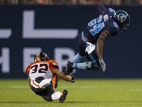 Toronto Argonauts wide receiver Llevi Noel (84) gets tackled by BC Lions defensive back Branden Dozier (32) during second half CFL football action in Toronto, on Saturday, July 6, 2019. THE CANADIAN PRESS/Andrew Lahodynskyj
