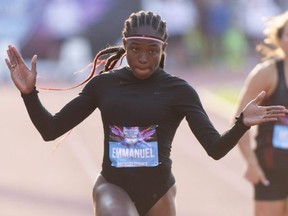 Crystal Emmanuel reacts as she crosses the finish line in the women's 100-metre semifinals at the Canadian Championships in Montreal on Friday, July 26, 2019.