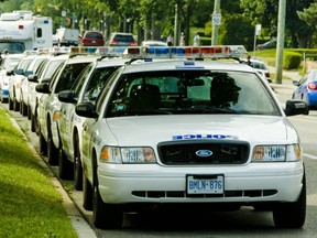 Toronto Police cars are pictured on Morningside Ave after the mass shooting on Danzig St. on July 17, 2012. (Ernest Doroszuk, Toronto Sun)