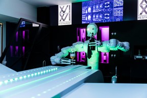 Restaurant Le XVI XVI’s robot bartender R1-B1 pours a drink in this file photo.