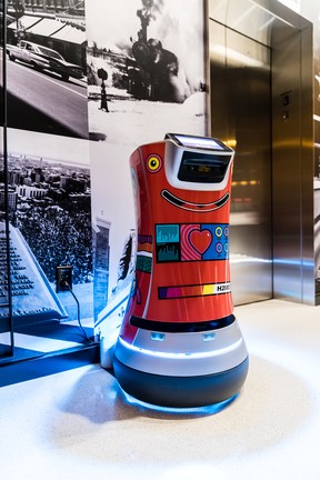 Hotel Monville’s room service robot waits patiently in the lobby, awaiting his next order.