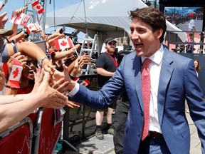 Prime Minister Justin Trudeau and his son, Hadrien, greet Canadians during Canada Day festivities on Parliament Hill in Ottawa, Ontario, Canada July 1, 2019. REUTERS/Patrick Doyle ORG XMIT: GGG-OTW105