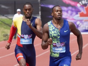 Aaron Brown (right) edges out Brendon Rodney (left) to win the gold medal in the men's 200-metre race at the Canadian Track And Field Championships in Montreal on Sunday, July 28, 2019.