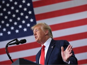 In this file photo taken on July 12, 2019 US President Donald Trump speaks on the United StatesMexicoCanada Agreement (USMCA) trade agreement at Derco Aerospace Inc. plant in Milwaukee, Wisconsin.