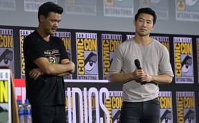 Canadian actor Simu Liu, right, and director Destin Daniel Cretton speak on stage for the Marvel panel during Comic Con in San Diego, Calif. on July 20, 2019. (Chris Delmas / AFP)CHRIS DELMAS/AFP/Getty Images