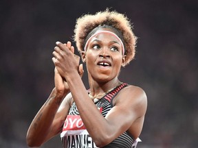 Canada's Crystal Emmanuel reacts after competing in the semi-final of the women's 200m athletics event at the 2017 IAAF World Championships at the London Stadium in London on August 10, 2017.