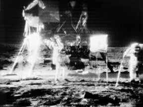 Apollo 11 astronauts Neil Armstrong and Buzz Aldrin on the surface of the moon, transmitted by the remote TV camera they deployed.