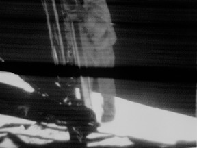 Apollo 11 astronaut Neil Armstrong descends the Lunar Module ladder, about to step onto the surface of the moon. Image transmitted to Earth by the Eagle's onboard TV camera. Photo: NASA