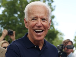 Democratic 2020 U.S. presidential candidate and former vice-president Joe Biden greets supporters at the Independence Day parade in Independence, Iowa, July 4, 2019.