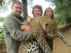 Jacques and Martine Alboud pose with a leopard they killed on a big game safari in Tanzania in 2014.