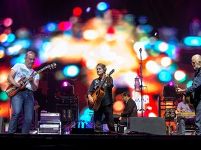 Colin Cripps (L), Jim Cuddy (C) and Greg Keelor (R) of Blue Rodeo, seen here at the RBC Bluesfest in Ottawa last summer, will play the Budweiser Stage in Toronto on Aug. 24, 2019. (Wayne Cuddington/Postmedia)