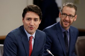 Canada’s Prime Minister Justin Trudeau (L) and his then principal secretary Gerald Butts take part in a meeting with Italy’s Prime Minister Paolo Gentiloni (not pictured) on Parliament Hill in Ottawa, Ontario, Canada, on April 21, 2017. (REUTERS/Chris Wattie)