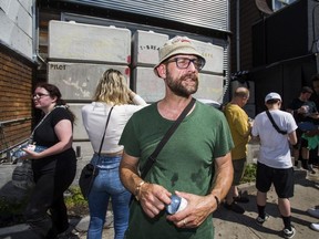 Medical cannabis user and customer of CAFE dispensary on Harbord St. Kevin Busch, was able to purchase product, despite the front of the shop being blocked by a wall of concrete blocks in Toronto, Ont. on Saturday July 20, 2019.