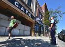 Toronto police special constables guard closed-down Bloor St. W. CAFE cannabis dispensary after crews with heavy machinery attempted to remove concrete blocks sealing the entrance on Thursday, July 18 2019.