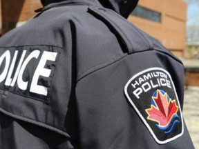 A Hamilton police logo.