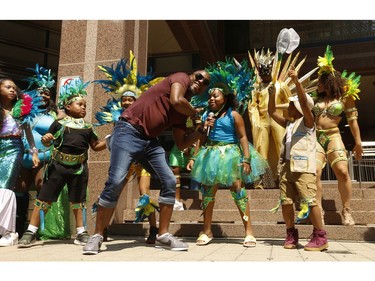 Jaxx Soca gets into some dancing with tiny Toronto Revellers at the Toronto Police held there Caribbean Carnival kick-off 2019 in preparation for the parade on August 3rd weekend on Friday July 26, 2019. Jack Boland/Toronto Sun/Postmedia Network
