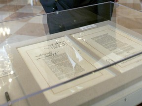 The first and last pages of the original Title VII Civil Rights Act of 1964 Document are seen on display inside the White House July 1, 2004.