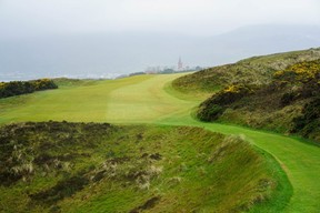 As if Royal County Down isn’t hard enough, why not add some driving rain. The peak of the Slieve Donard Resort & Spa can be seen in the distance. (Jon McCarthy)