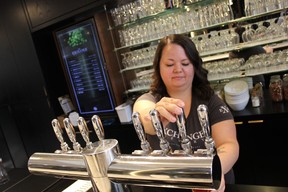 Crystal Costa, an employee at The Exchange Brewery, pours some of the good stuff. (Ian Shantz/Toronto Sun)