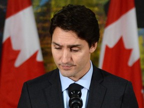 Canadian Prime Minister Justin Trudeau pauses as he addresses the media on the terrorist attacks in Paris prior to his departure for the G20 and APEC summits from Ottawa, Friday November 13, 2015. Trudeau says Canada has offered all the support it can to France following Friday's attacks in Paris. THE CANADIAN PRESS/Sean Kilpatrick ORG XMIT: SKP501