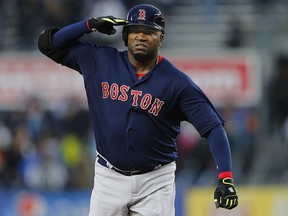 David Ortiz of the Boston Red Sox salutes as he round second base after hitting a home run against the New York Yankees May 6, 2016 in New York.