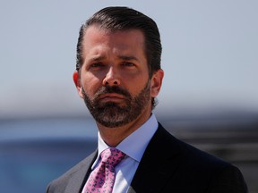 Donald Trump Jr. arrives with his father U.S. President Donald Trump (not pictured) after landing aboard Air Force One at General Mitchell International Airport in Milwaukee, Wis., July 12, 2019.