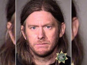 Ryan Douglas Bishop allegedly brought his cat to a burglary where he donned the homeowners Christmas pajama onesie. (MULTNOMAH COUNTY SHERIFF'S DEPARTMENT)