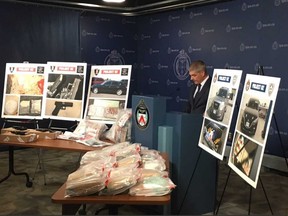 Toronto Police Insp. Don Belanger (pictured) said officers taking part in Project Oz seized large amounts of deadly fentanyl, cocaine and six handguns. Six people face charges and police are looking for two other suspects. (Jane Stevenson, Toronto Sun)