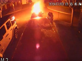 A Chevrolet Cruze in a driveway in the Ritson Road North and Beatrice Street East area of Oshawa goes up in flames on July 3, 2019. (Screengrab)