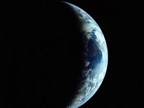 A crescent view of the Earth as seen by Apollo 11 astronauts on their return from the moon. Photo: NASA